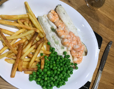 homemade fish and chips with prawns and peas