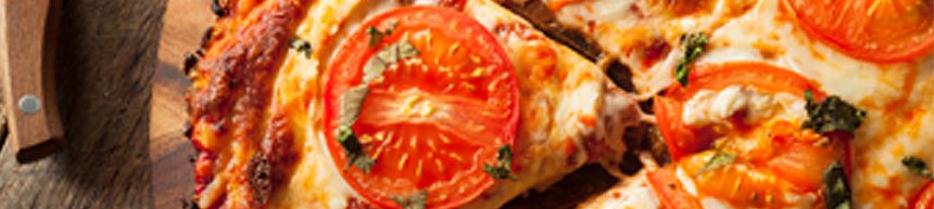 margherita pizza with tomato and herbs on top