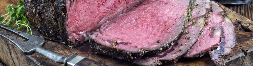 sliced beef on a piece of wood