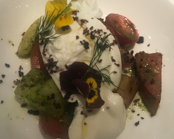 burrata with tomatoes and edible flowers