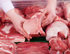 butcher holding meat 
